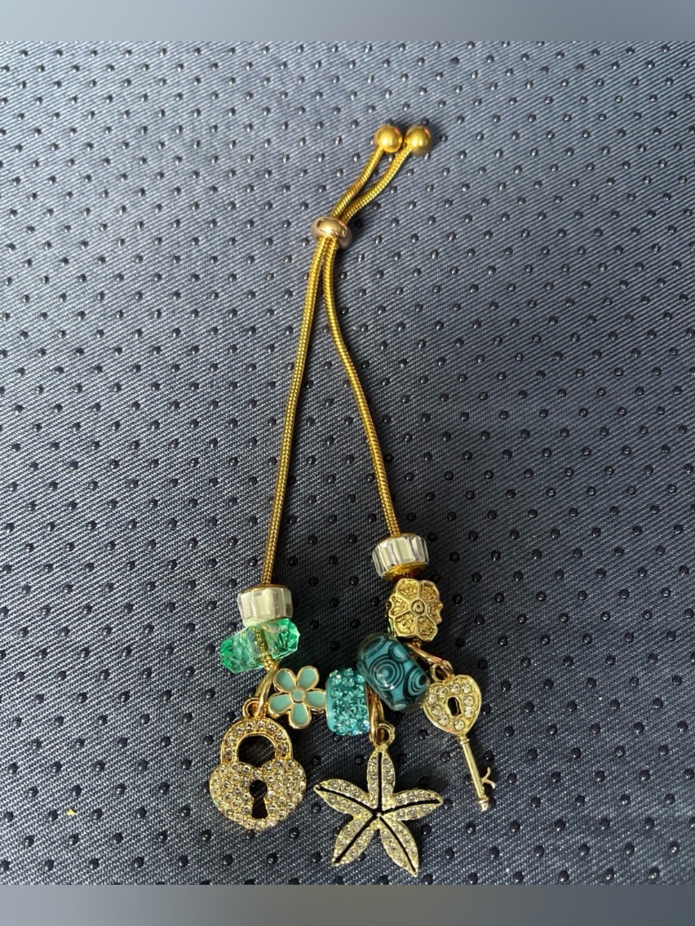 Gold-Tone Green Charm Bracelet with Locks and Starfish